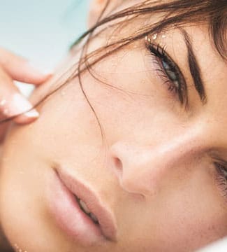 close up tilt view of woman's face as she squints